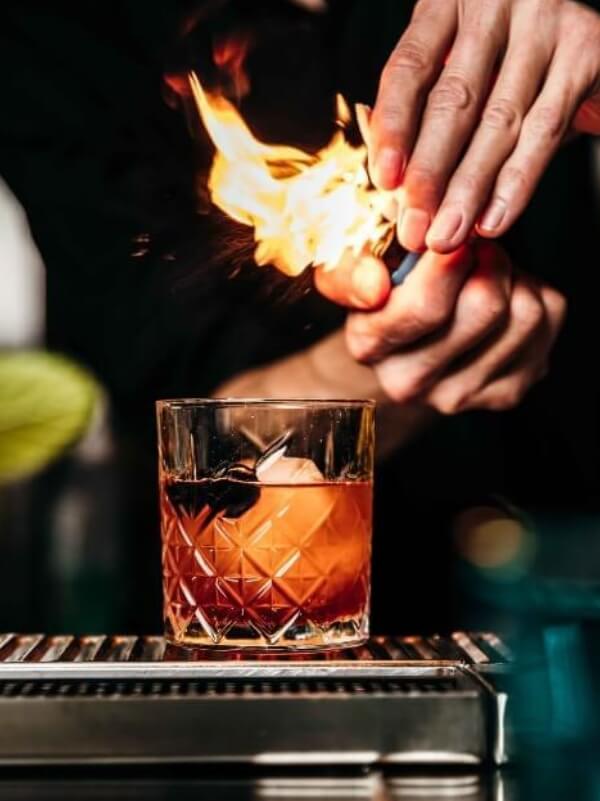 Miss Kō - Bartender making a cocktail at Miss Kō in a tumbler glass