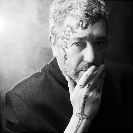 Miss Ko - Photograph of a tattooed man